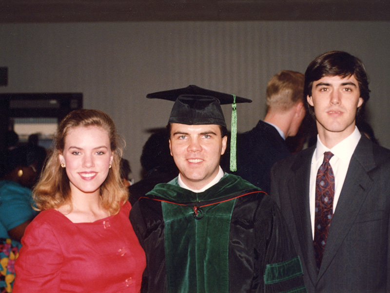 On medical school graduation day, 1992, Dr. Mark Ladner is congratulated by his sister, Hope Ladner, and his brother, Kirk Ladner. (Photo courtesy of Dr. Mark Ladner)